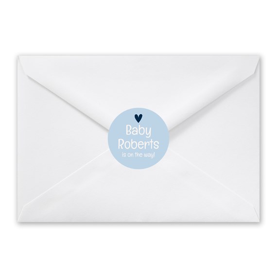 white envelope with circular seal for baby announcement