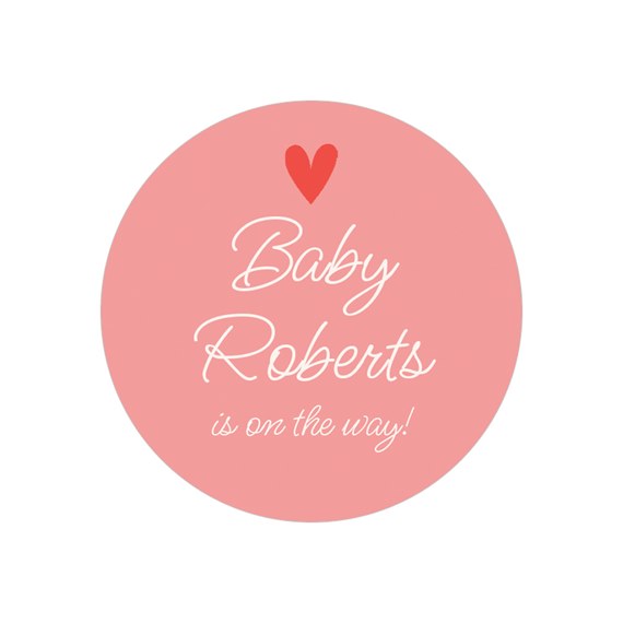 pink round sticker with heart and text