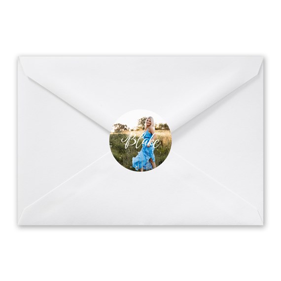white envelope with circular photo placeholder and scripted text