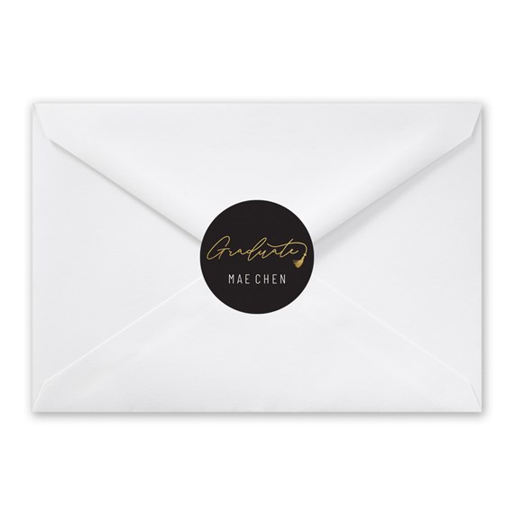 white envelope with black and gold seal sticker