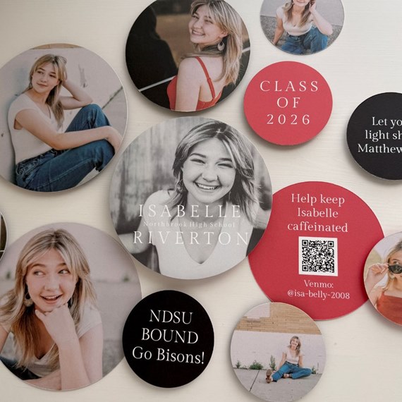 round graduation coasters with various designs and text