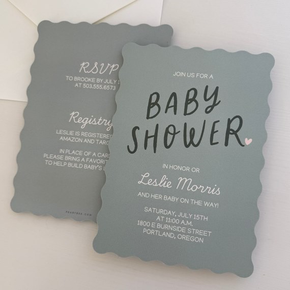 baby shower invitation with scalloped edges and gray background