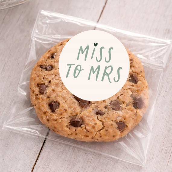 cookie with round sticker saying 'MISS TO MRS'