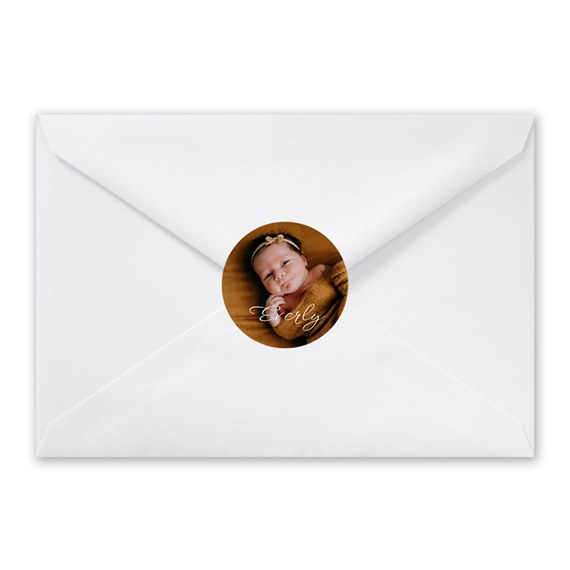 white envelope with photo placeholder and circular seal