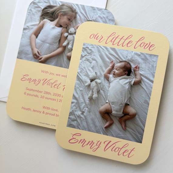 two birth announcement cards with photo areas and pink text