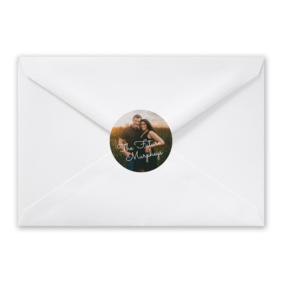 white envelope with photo placeholder and script text seal