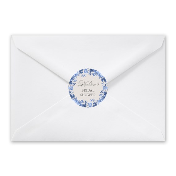 white envelope with floral seal and customizable text area