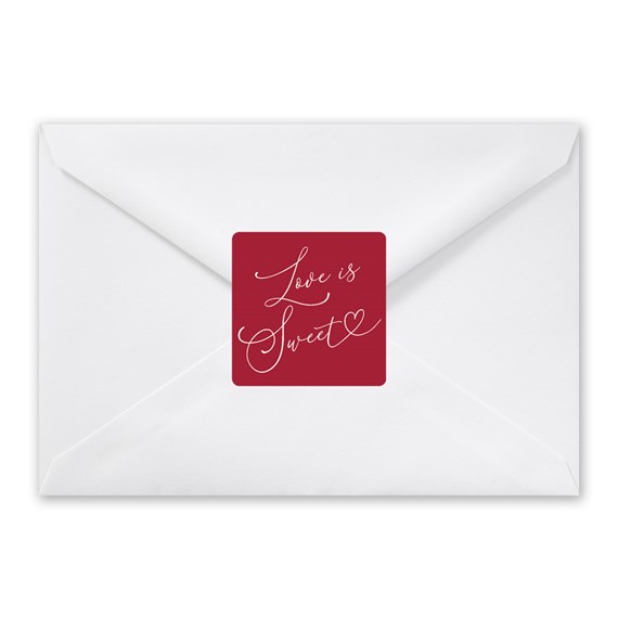 red seal with love is sweet text on white envelope
