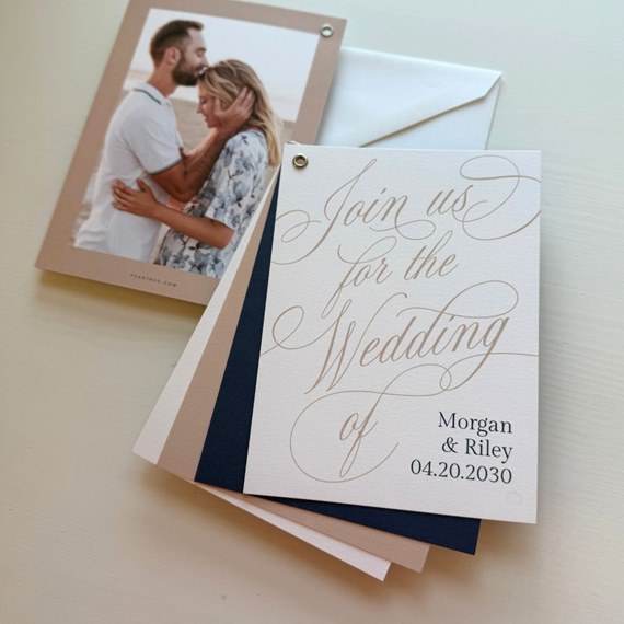 elegant wedding invitation with gold script and navy border