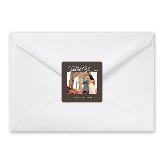 white envelope with brown seal and thank you text