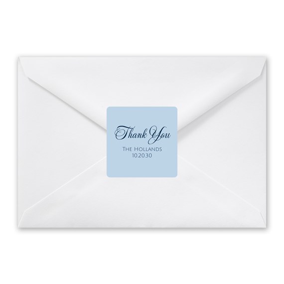 white envelope with blue thank you label