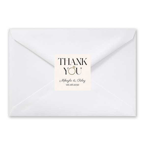 white envelope with thank you sticker