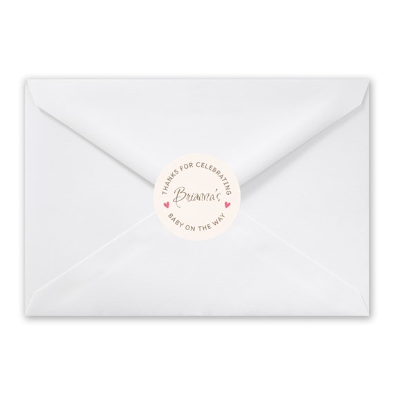 white envelope with round seal and text