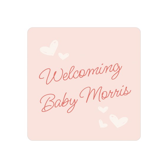 pink sticker with welcoming text and hearts