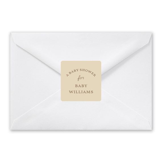 white envelope with beige seal and text