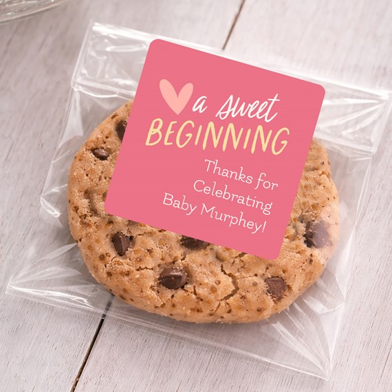 cookie in clear bag with pink sticker, photo area