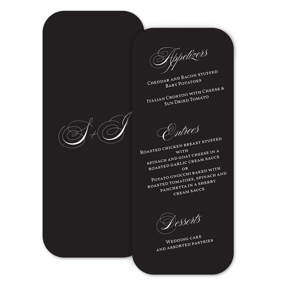 black menu card with white text and cursive initials