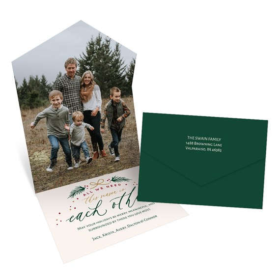 folded card with family photo area, text about togetherness, dark green envelope