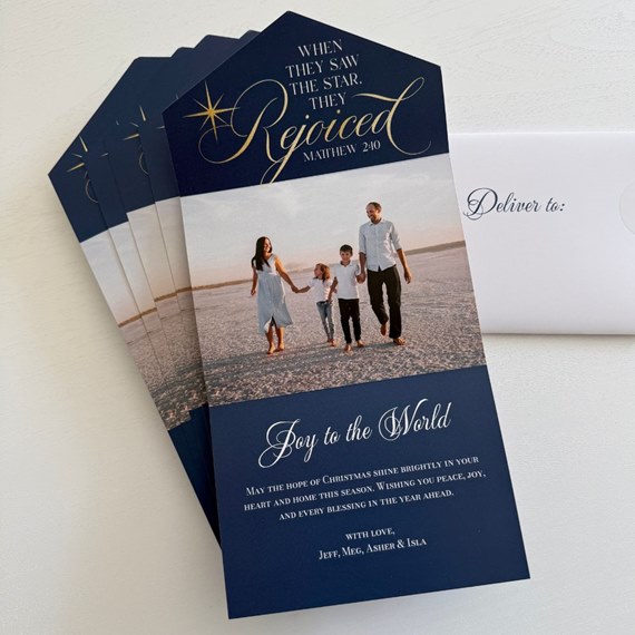 navy blue Christmas card with photo area and gold text