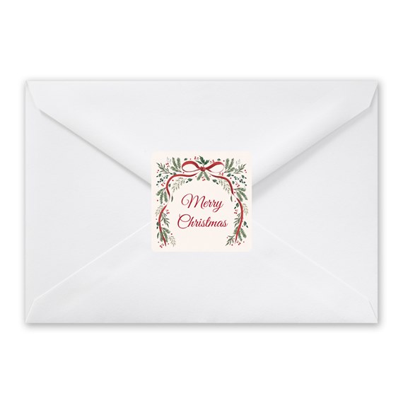 white envelope with botanical seal and text