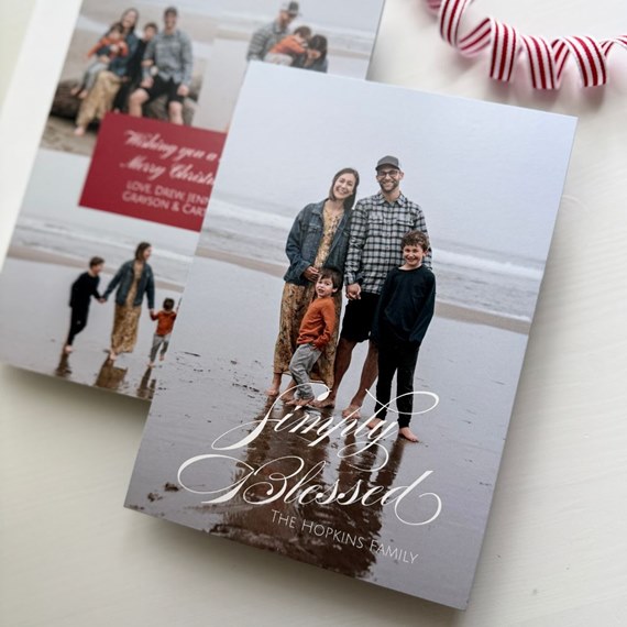 Christmas card with family photo area and red text