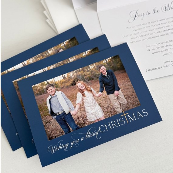 navy blue Christmas card with photo area and text
