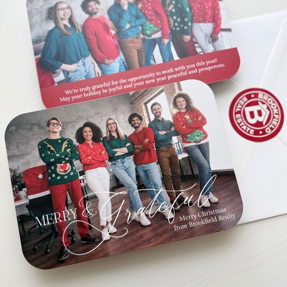 holiday card with festive group photo and decorative text