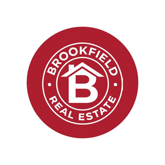 circular logo with house icon and text
