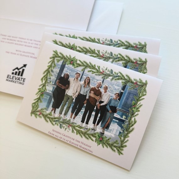 holiday card with garland design and photo area