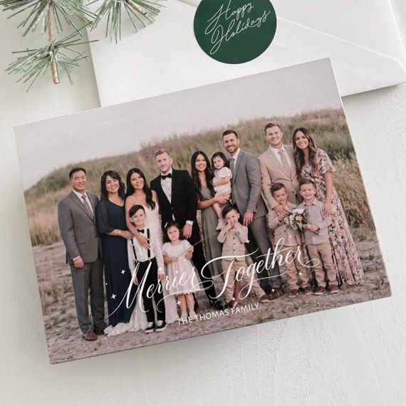 holiday card with family photo and decorative text