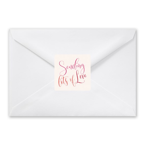 white envelope with pink text sticker