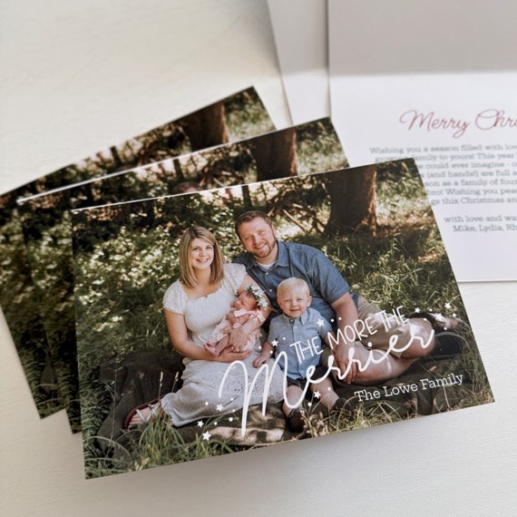 Christmas card with family photo and decorative text