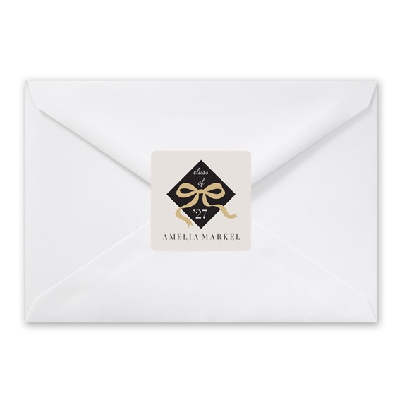 envelope with seal featuring bow and text