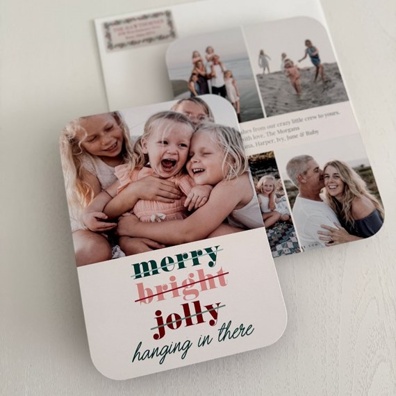 photo area with text 'merry bright jolly hanging in there'