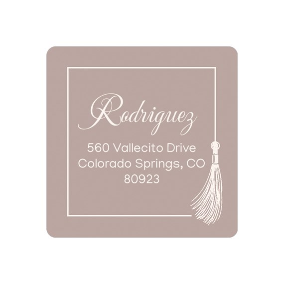 square address label with tassel and white text