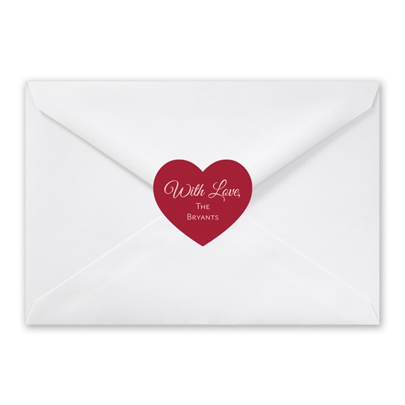 white envelope with red heart-shaped seal and text