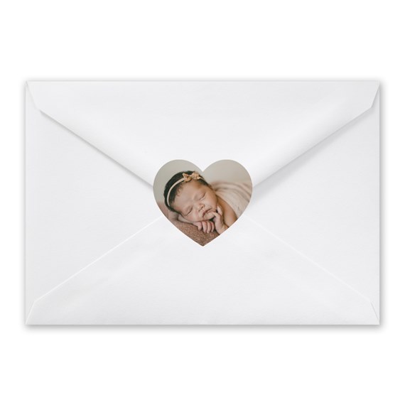 white envelope with heart-shaped photo area
