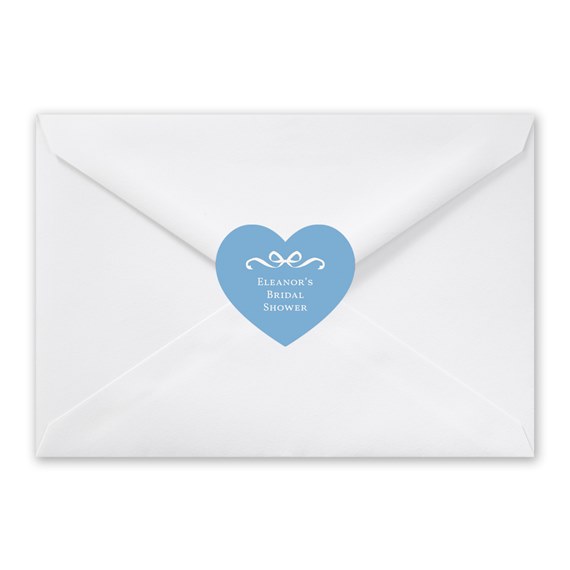 heart-shaped envelope seal with bow and text