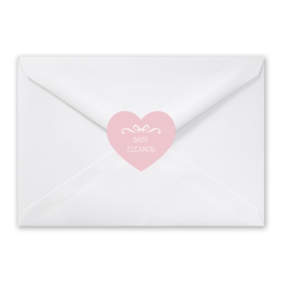 white envelope with pink heart seal