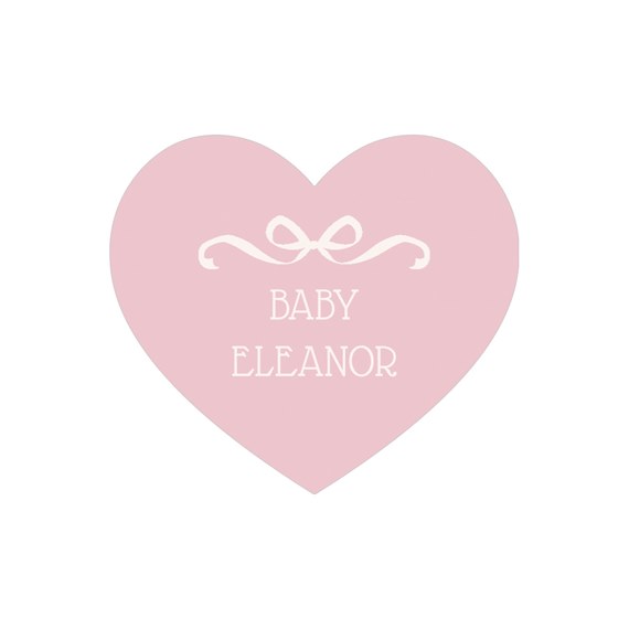 heart-shaped envelope seal with bow and text