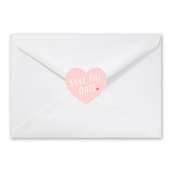 white envelope with heart-shaped seal and text