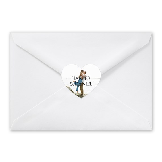 white envelope with heart-shaped photo placeholder seal