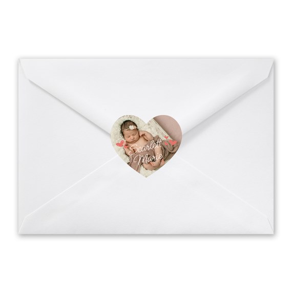 heart-shaped photo placeholder seal on white envelope
