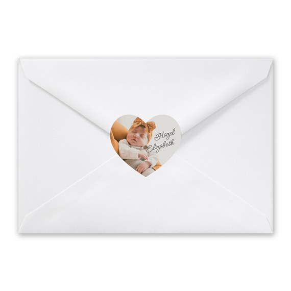 white envelope with heart-shaped photo placeholder and name area