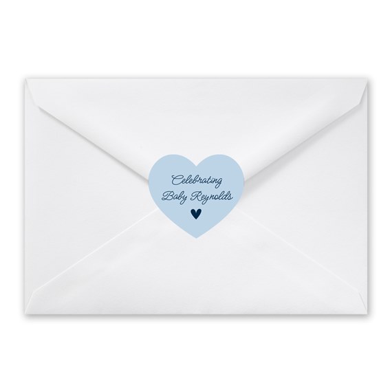 white envelope with light blue heart seal and dark blue text