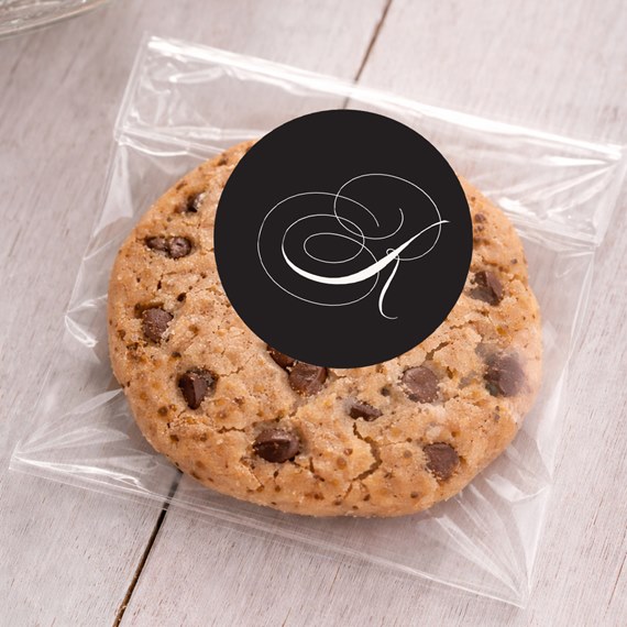 black sticker with white monogram on cookie bag