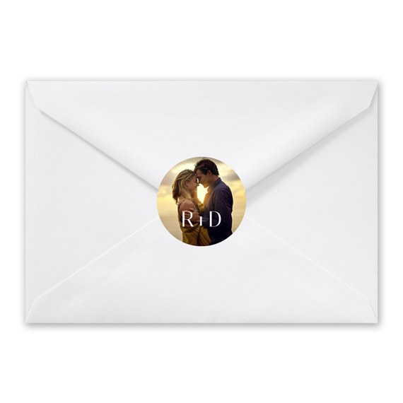 white envelope with circular photo placeholder and initials