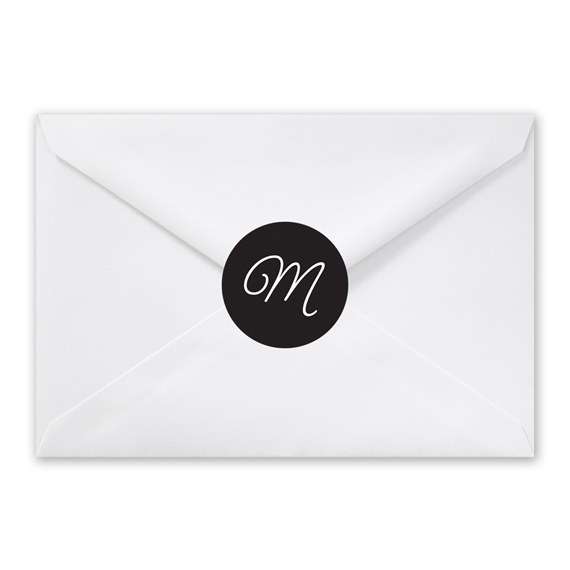 white envelope with black seal and letter M