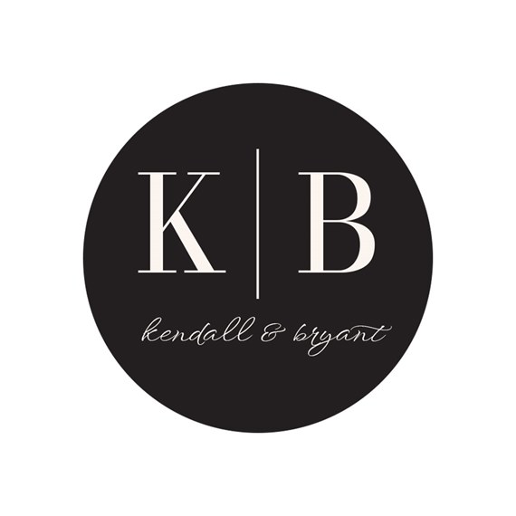 circular seal design with initials and script text