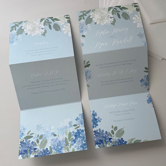 A5 floral invitation with blue and green designs and text areas